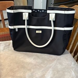 Code Happy Bag. Lots of room. Lots of pockets. Laptop fits in bag.